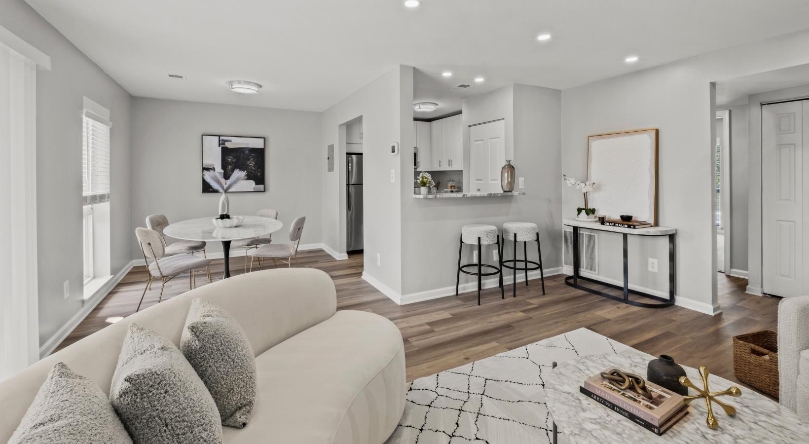 a living room with a dining table